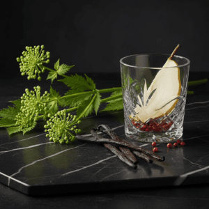 Green angelica stems and black vanilla pods, illustrating the contrast of the Angélique Noire perfume by Guerlain.